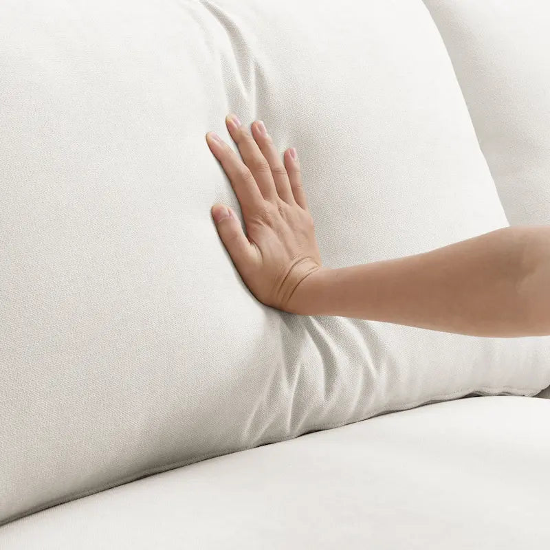 Divano componibile a forma di L con cuscini, pouf e seduta larga