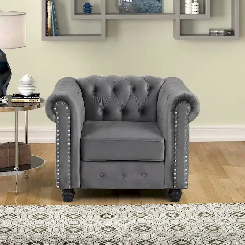 Poltrona Chesterfield in velluto Morden Fort, poltrona imbottita con bottoni, borchie e gambe in legno massello per soggiorno