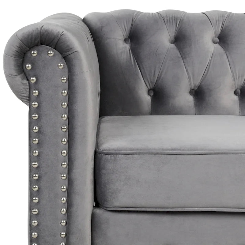 Poltrona Chesterfield in velluto Morden Fort, poltrona imbottita con bottoni, borchie e gambe in legno massello per soggiorno
