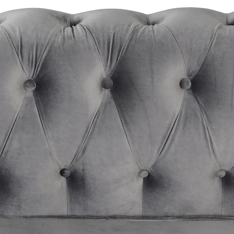 Poltrona Chesterfield in velluto Morden Fort, poltrona imbottita con bottoni, borchie e gambe in legno massello per soggiorno