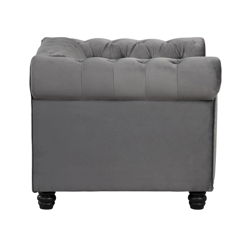 Poltrona Chesterfield in velluto Morden Fort, poltrona imbottita con bottoni, borchie e gambe in legno massello per soggiorno