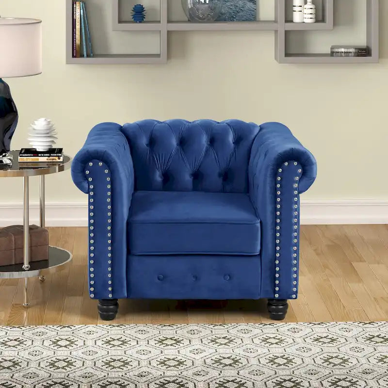 Poltrona Chesterfield in velluto Morden Fort, poltrona imbottita con bottoni, borchie e gambe in legno massello per soggiorno