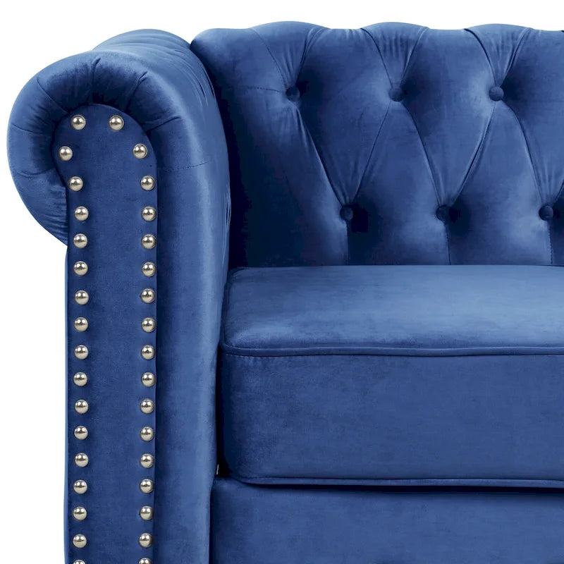 Poltrona Chesterfield in velluto Morden Fort, poltrona imbottita con bottoni, borchie e gambe in legno massello per soggiorno