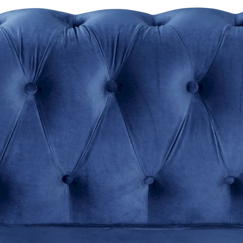 Poltrona Chesterfield in velluto Morden Fort, poltrona imbottita con bottoni, borchie e gambe in legno massello per soggiorno